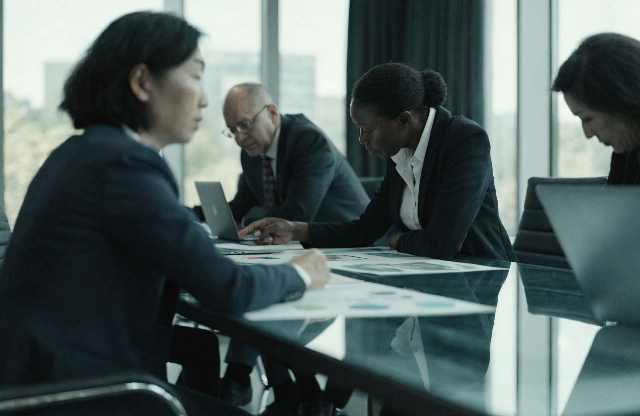 Executives collaborating in a modern boardroom strategy workshop